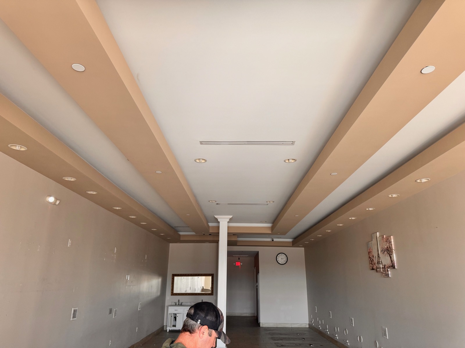 Before — the previous tenant's interior at the future Juice It Up Tempe location, with original tray ceiling, recessed lighting, and tile floor intact